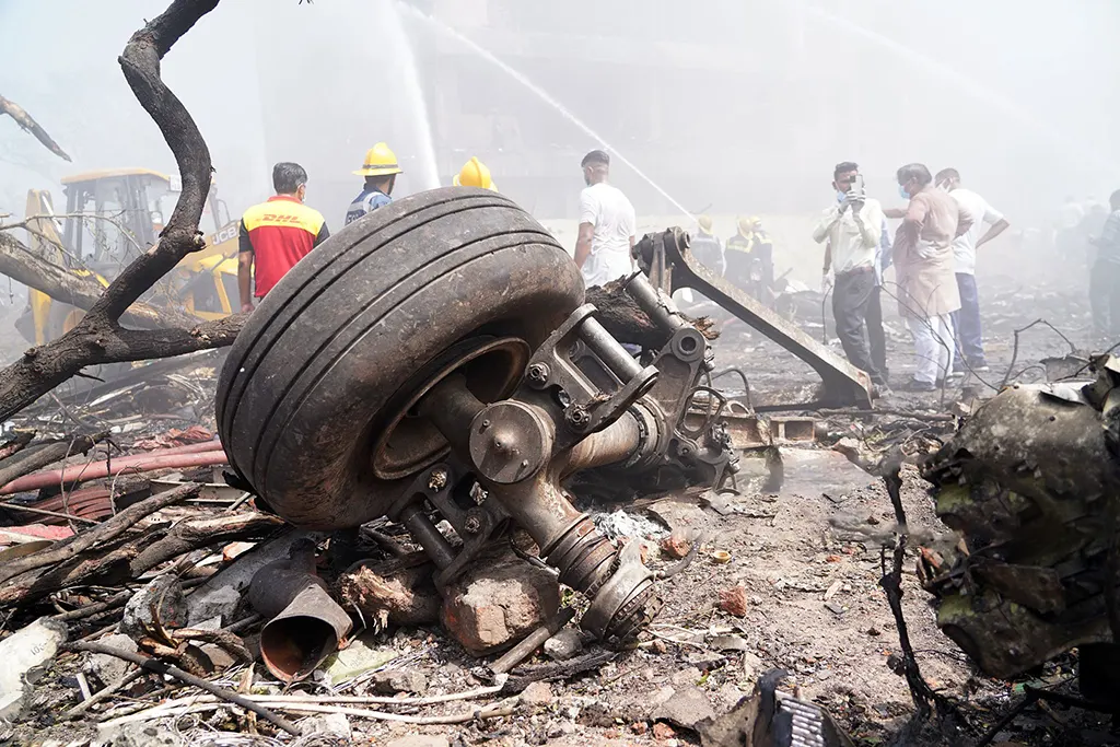boeing-787-dreamliner-crash-india-london Emergency services and rescue personnel at the crash site of Air India Flight AI171