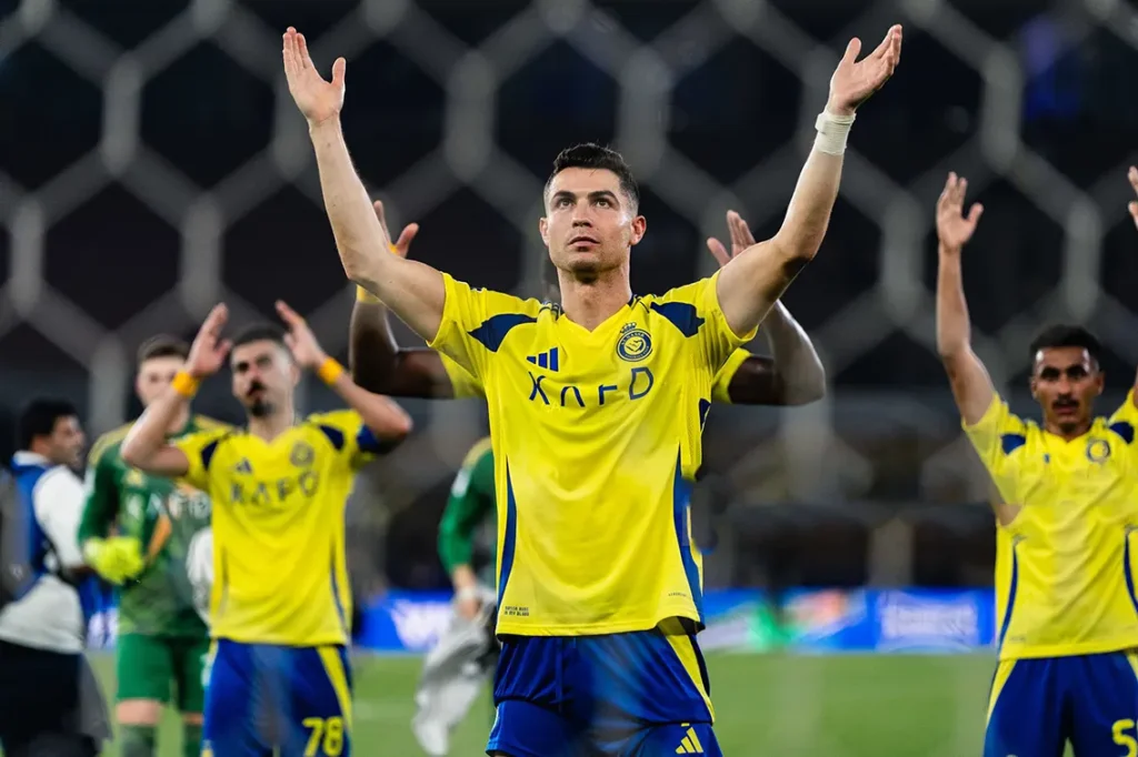 cristiano-ronaldo-al-nassr-transfer-rumors-june-2025 CR7 in action for Al Nassr during a match, highlighting his goal-scoring prowess amid rumors