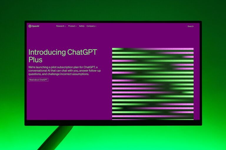 Close-up of a monitor displaying ChatGPT Plus introduction on a green background.