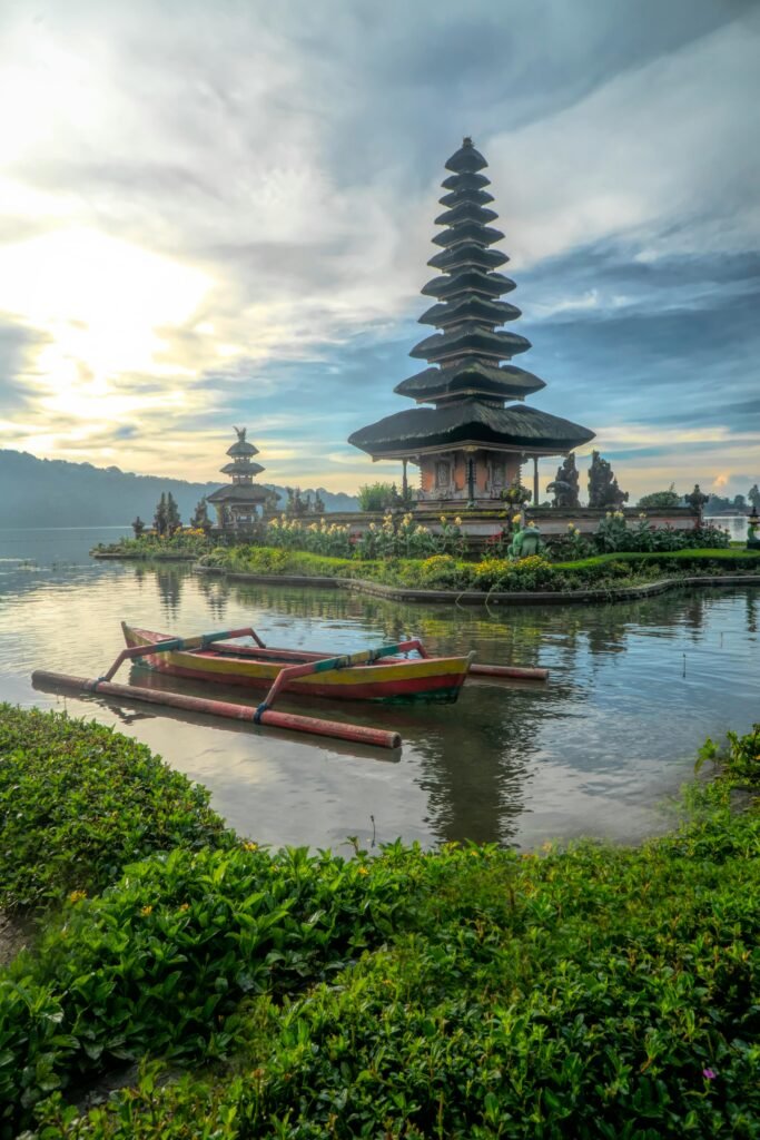 pexels-photo-2166559-2166559 Scenic view of Ulun Danu Beratan Temple with boats on Bratan Lake, Bali at dawn.