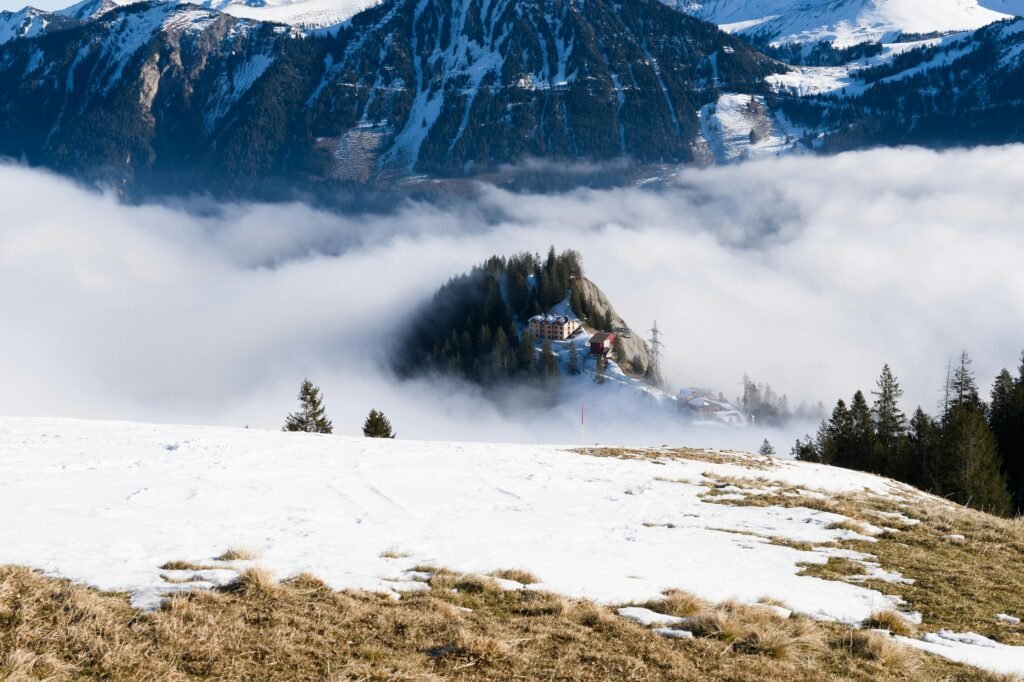 pexels-photo-31499101-31499101 Captivating winter view of the Swiss Alps with misty mountains and snow-covered terrain.