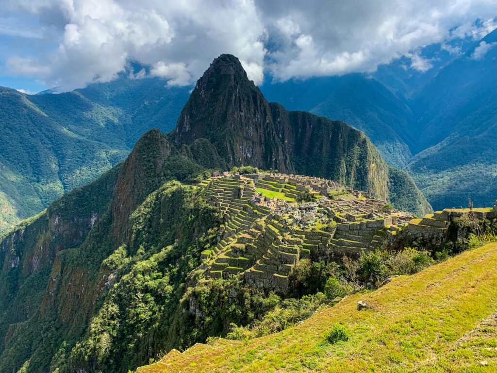 pexels-photo-3463964-3463964 A breathtaking view of Machu Picchu in Peru surrounded by lush mountains and clouds.