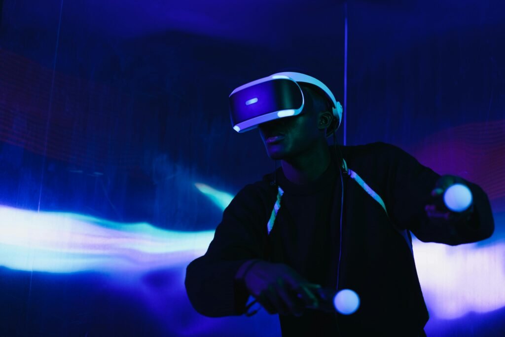 pexels-photo-7562239-7562239 A person engaged in a virtual reality game using a VR headset and motion controllers.