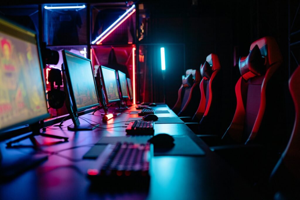pexels-photo-9072216-9072216 An immersive gaming room with neon lights, computers, and gaming chairs ready for a tournament.