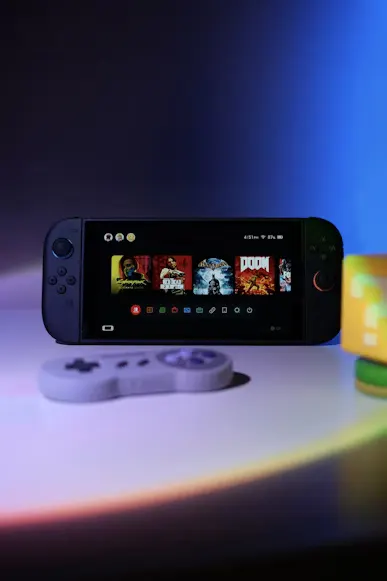 nintendo-switch-2-reveal-portable-powerhouse The new Nintendo Switch 2 console in handheld mode, displaying a high-fidelity game on its 8-inch screen, next to a detached Joy-Con Pro controller