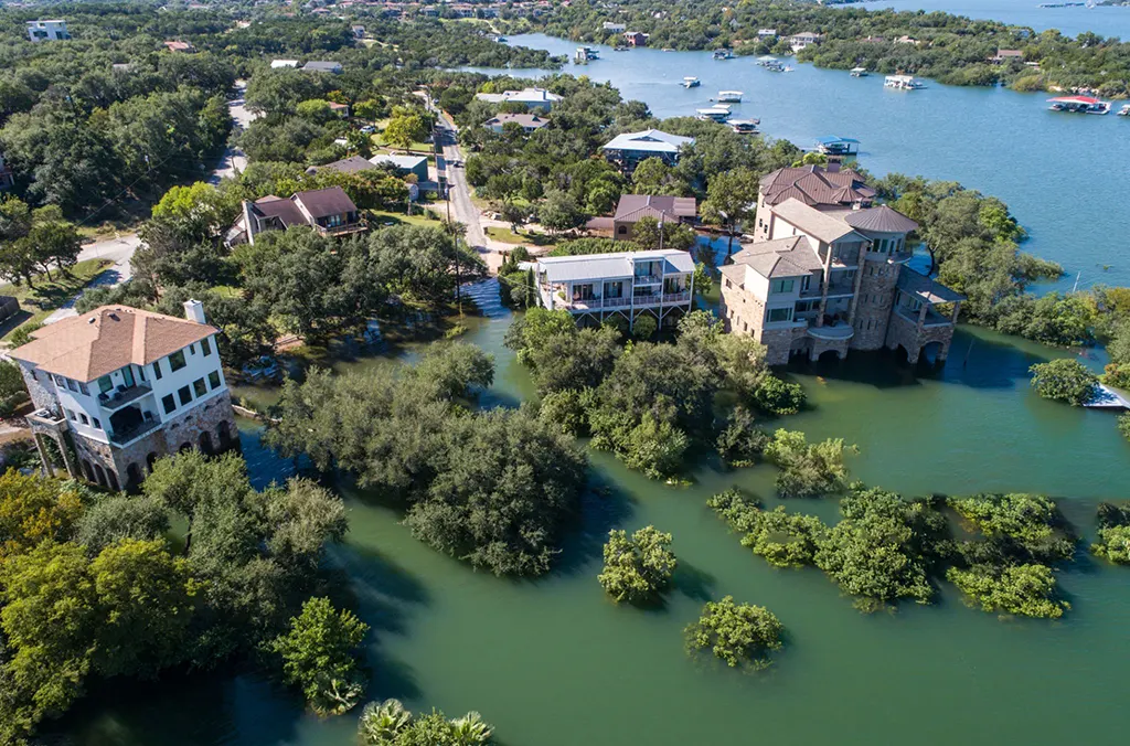 texas-hill-country-flood-devastation-human-cost showing submerged homes and roads during the devastating July 2025 floods