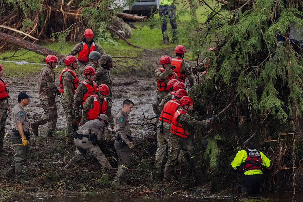texas-hill-country-flood-devastation debris from destroyed homes visible in the background