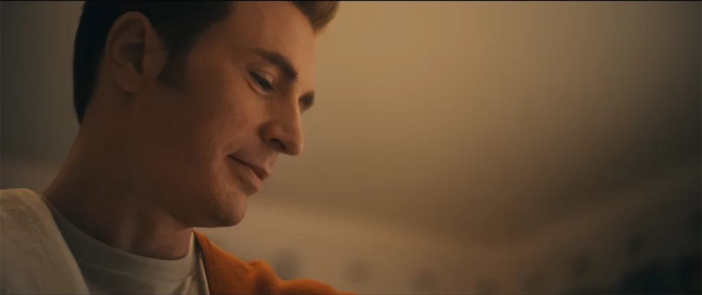 steve-rogers-chris-evans-return-fatherhood Chris Evans as a retired Steve Rogers packing away his Captain America suit and holding a baby in the new Doomsday teaser.